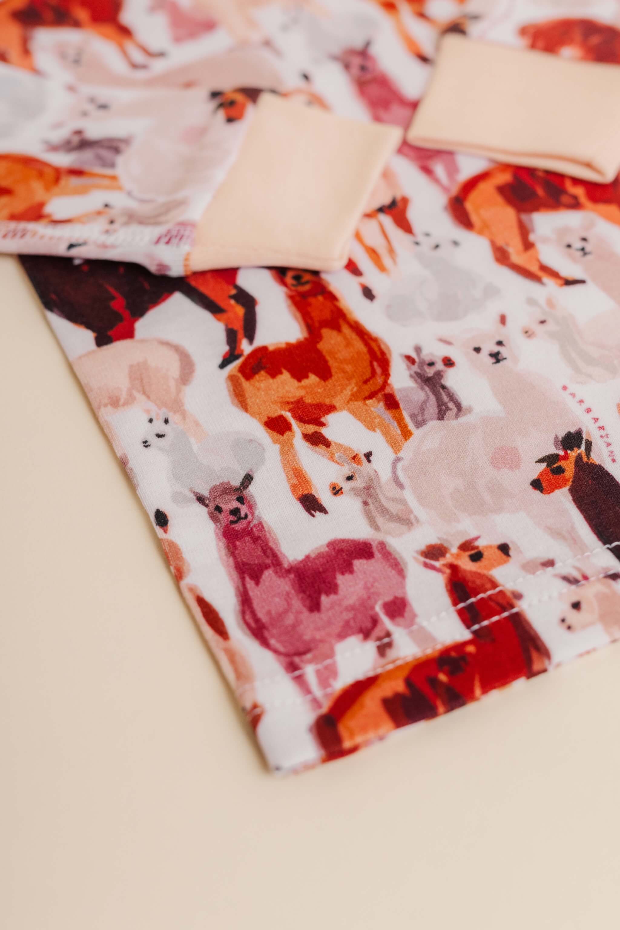 organic cotton children's long sleeve sleepwear in tan alpaca print designed by barbra ignatiev