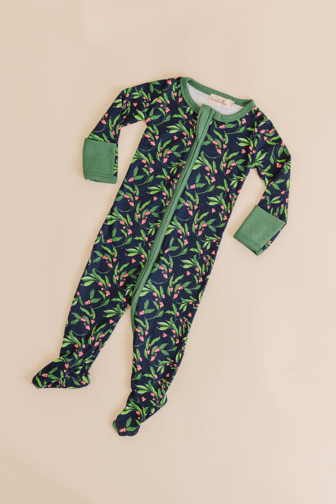 organic sleeper with mistletoe kisses design hand drawn by Taddy Mikelaites