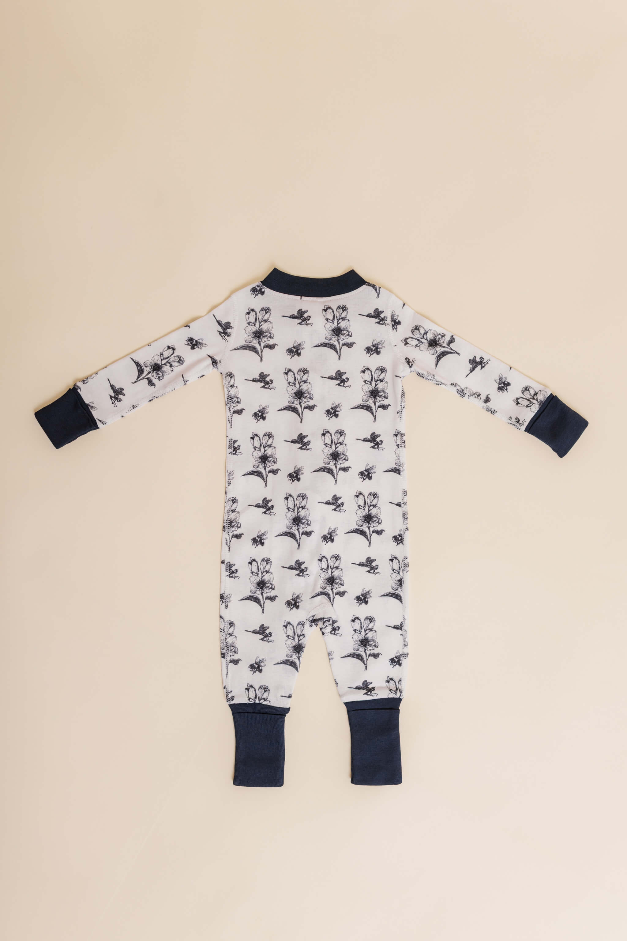 organic cotton baby zipper sleeper with fold-over cuffs in black ink print designed by chewie co