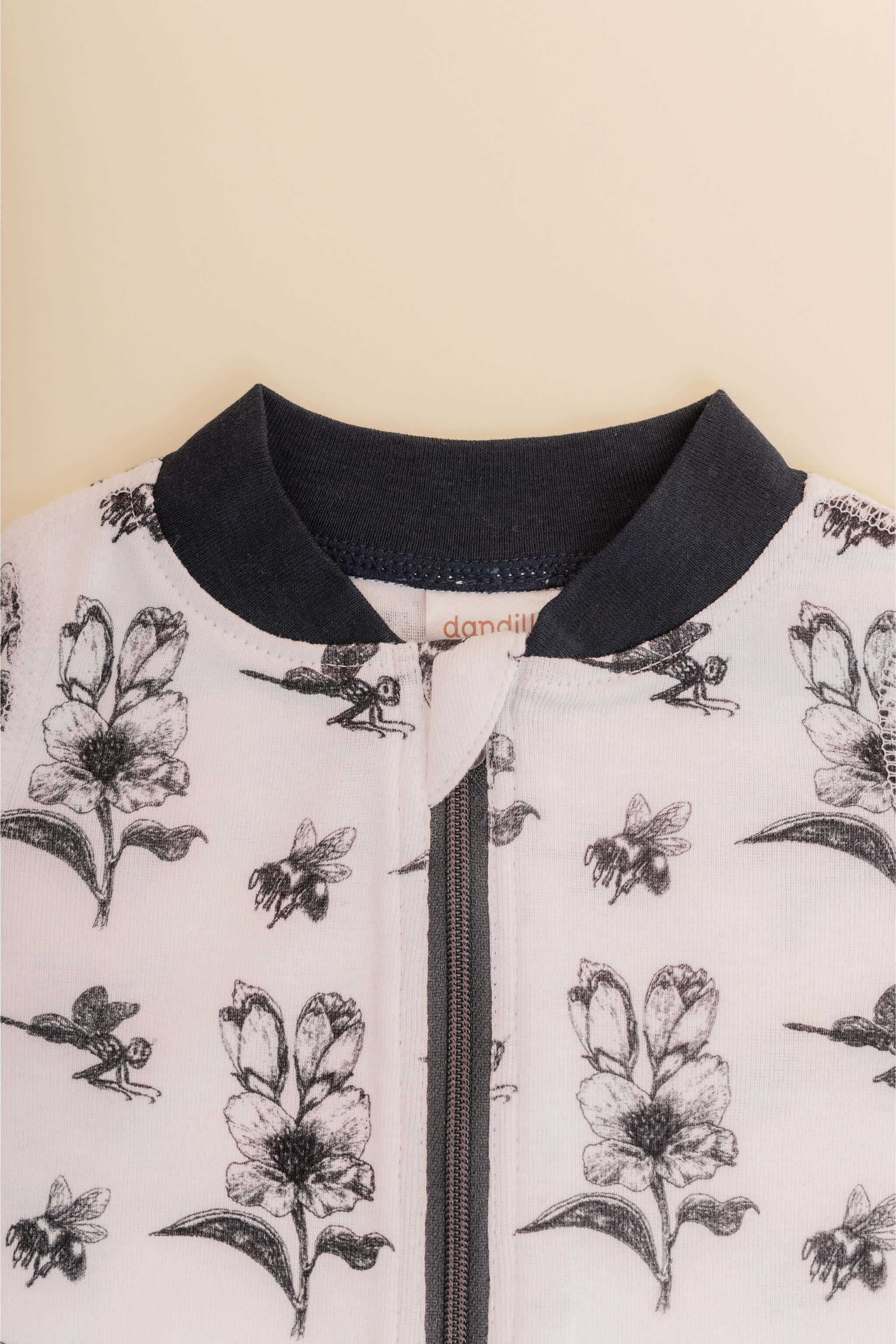 organic cotton baby zipper sleeper with fold-over cuffs in black ink print designed by chewie co