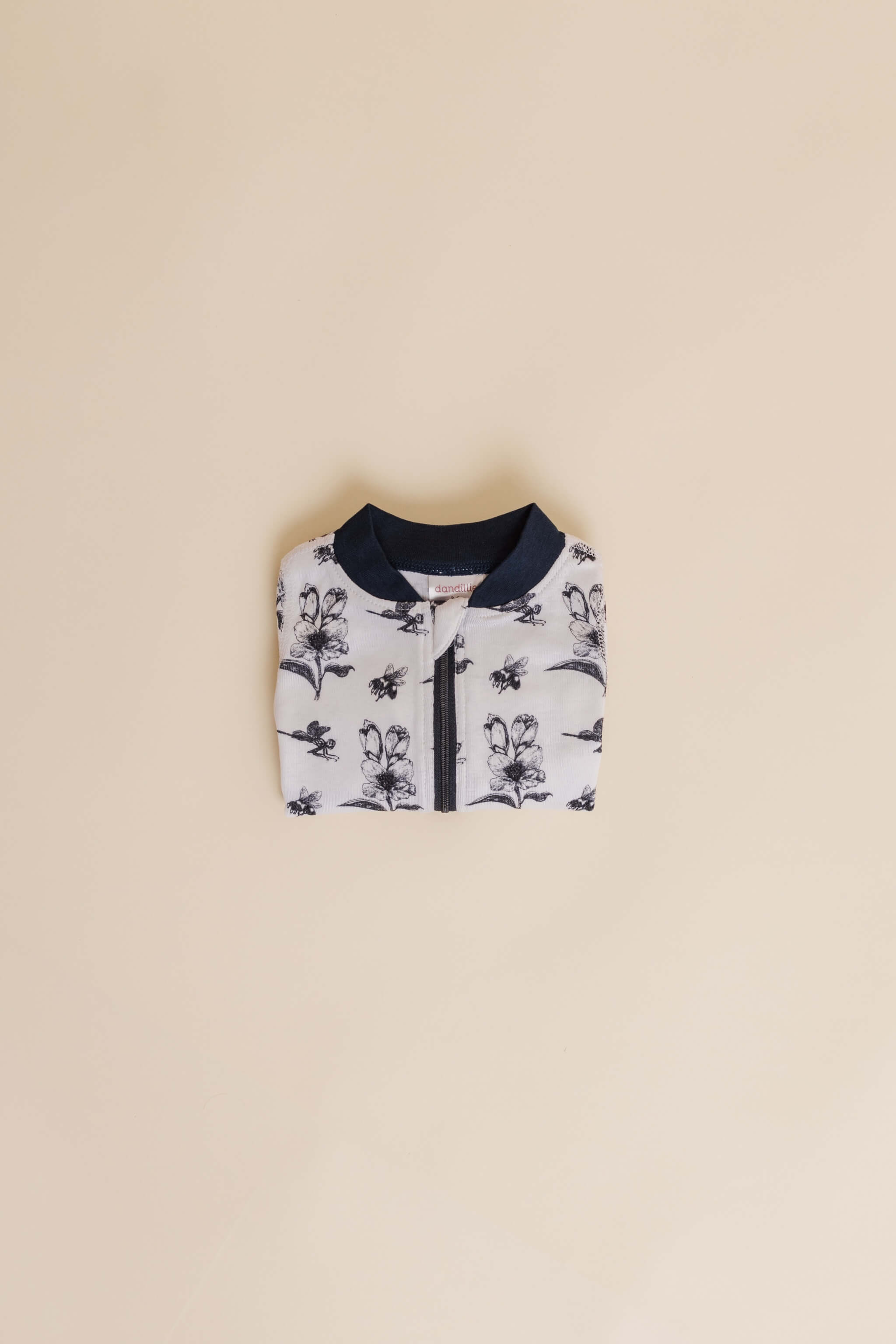 organic cotton baby zipper sleeper with fold-over cuffs in black ink print designed by chewie co